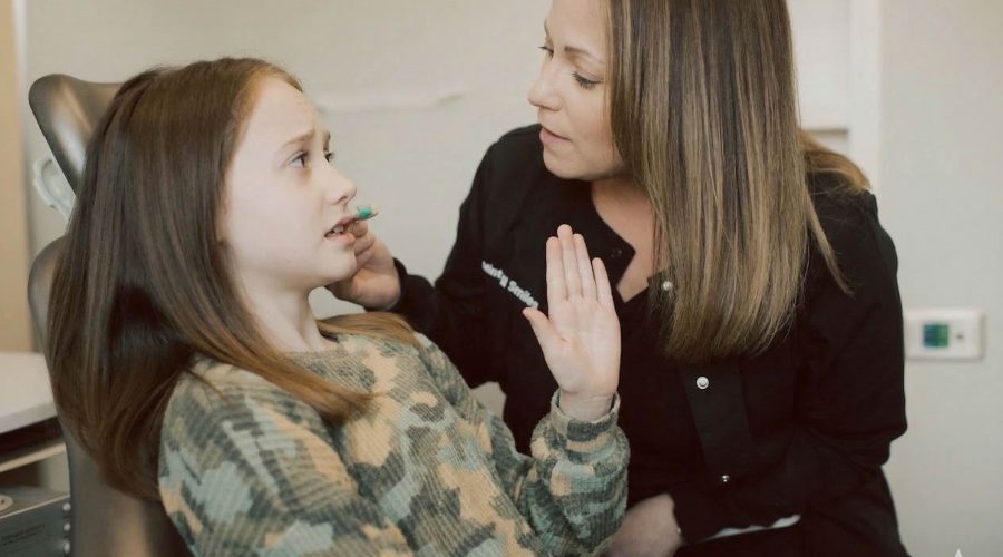 Patient expressing dental anxiety while speaking with a caring dental professional at Mint Hill Smiles
