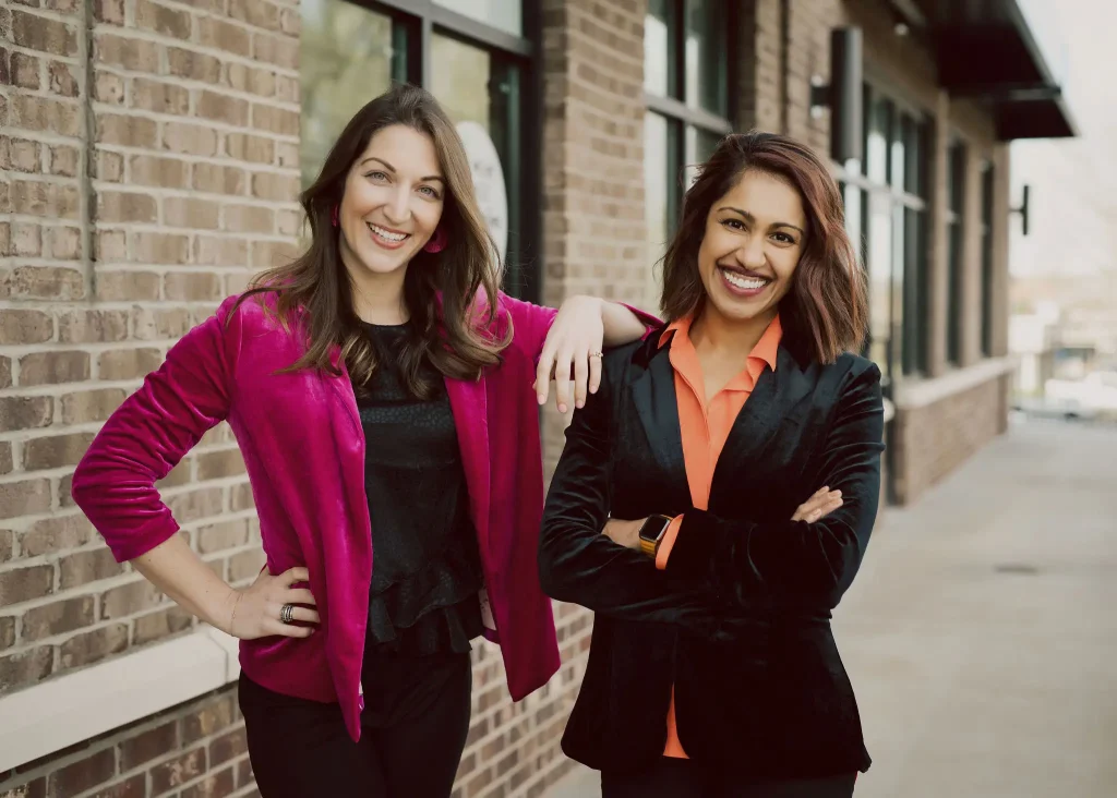 Cosmetic dentist reviewing veneers with a patient