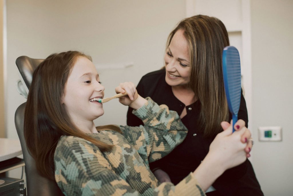 Dental hygienist with a patient at Mint Hill Smiles in Mint Hill, NC