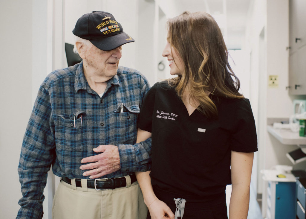 Dr. Marvelli with a senior patient at Mint Hill Smiles