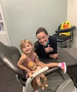 Dentist examining a child with crowded teeth and possible airway concerns