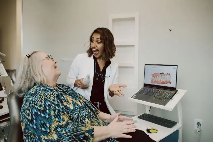 Woman receiving clear aligner treatment from a Mint Hill dentist.