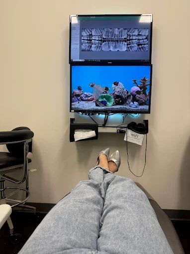Patient reviewing dental X-rays on a screen with AI dental imaging in Mint Hill, NC