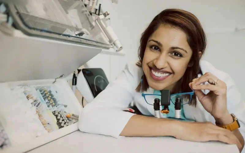 Dentist using AI X-ray analysis during a dental examination
