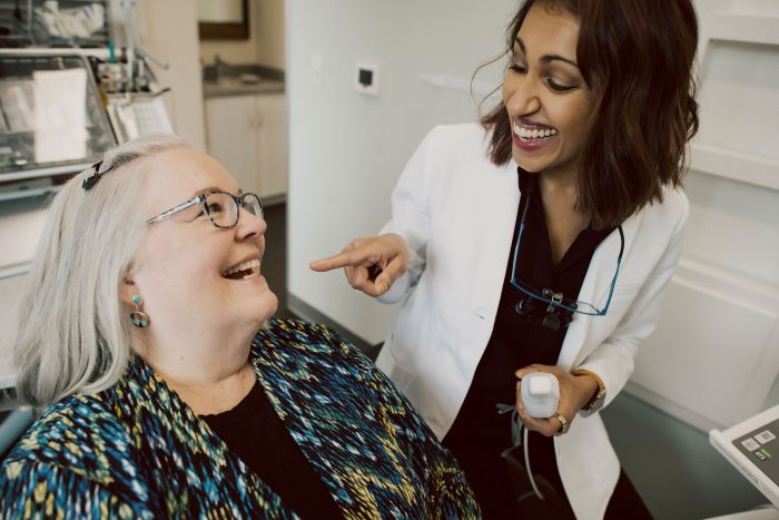 Patient finding relief from dental anxiety during a dental visit