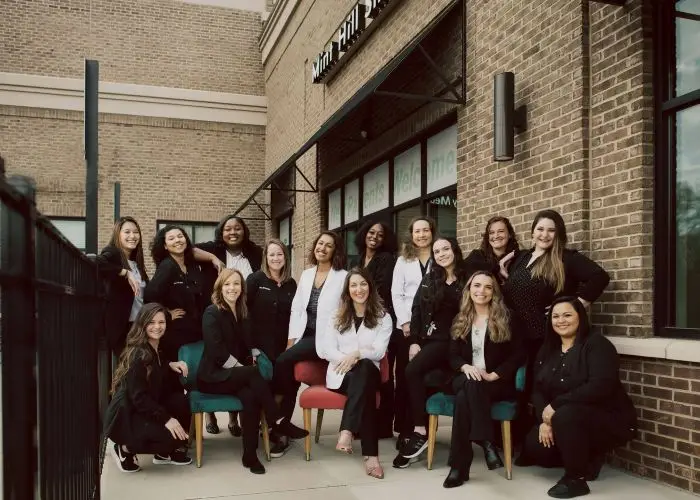 Dental team standing together inside a modern dental clinic in Mint Hill, NC,