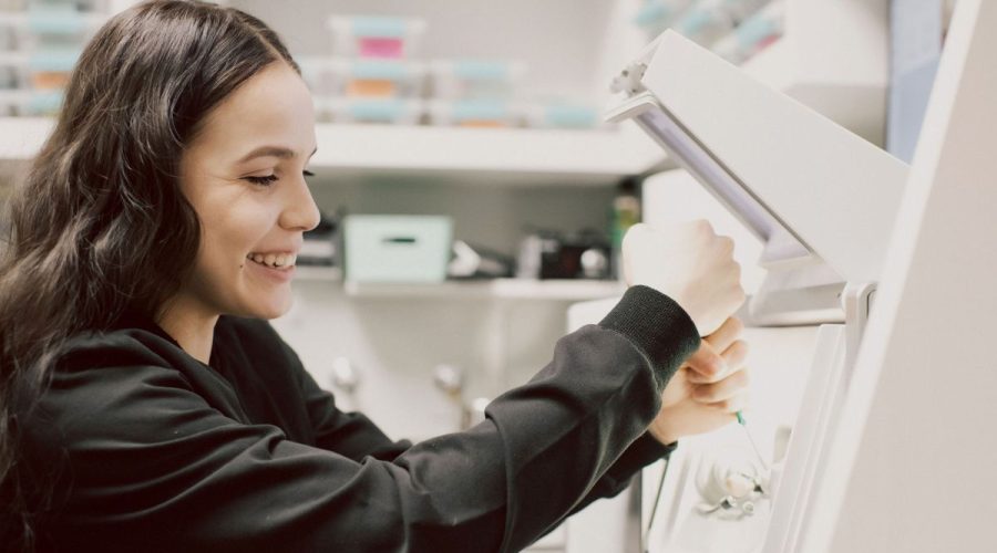 Dentist using in-house 3D printing technology to create custom dental appliances.