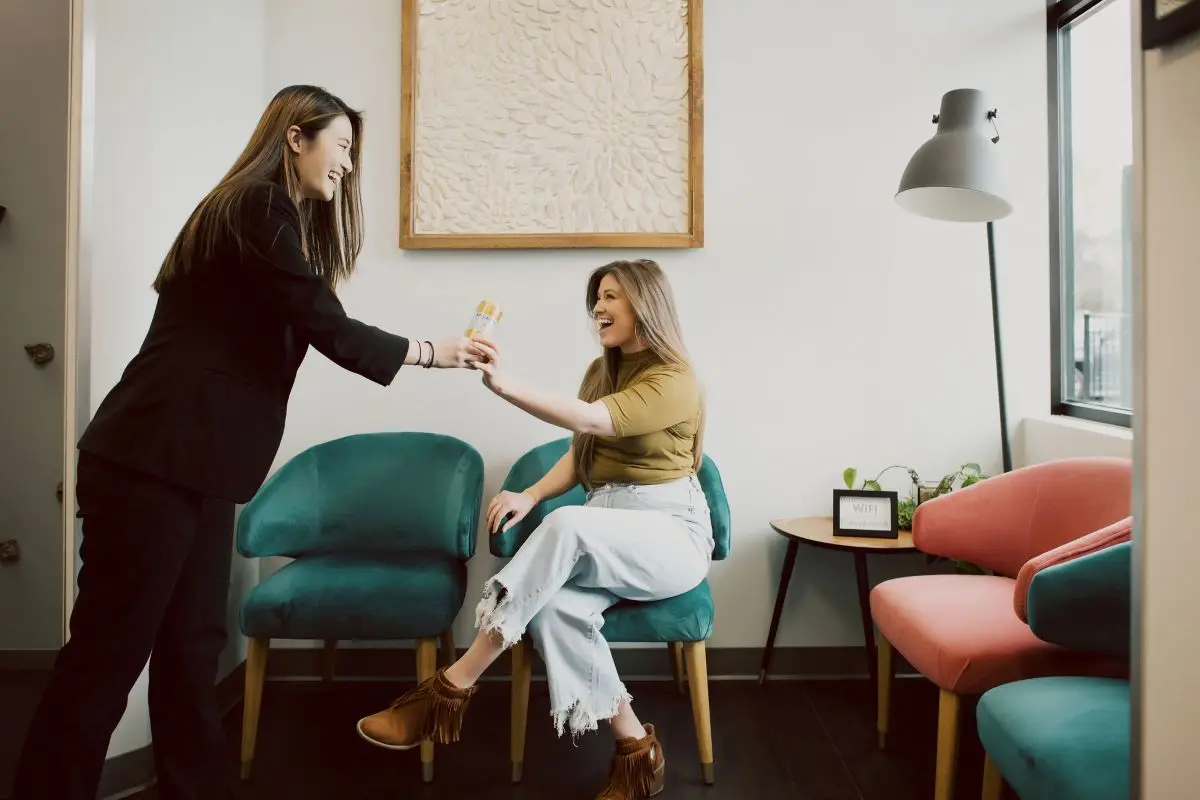 Friendly receptionist helping a patient feel comfortable at her dental appointment.